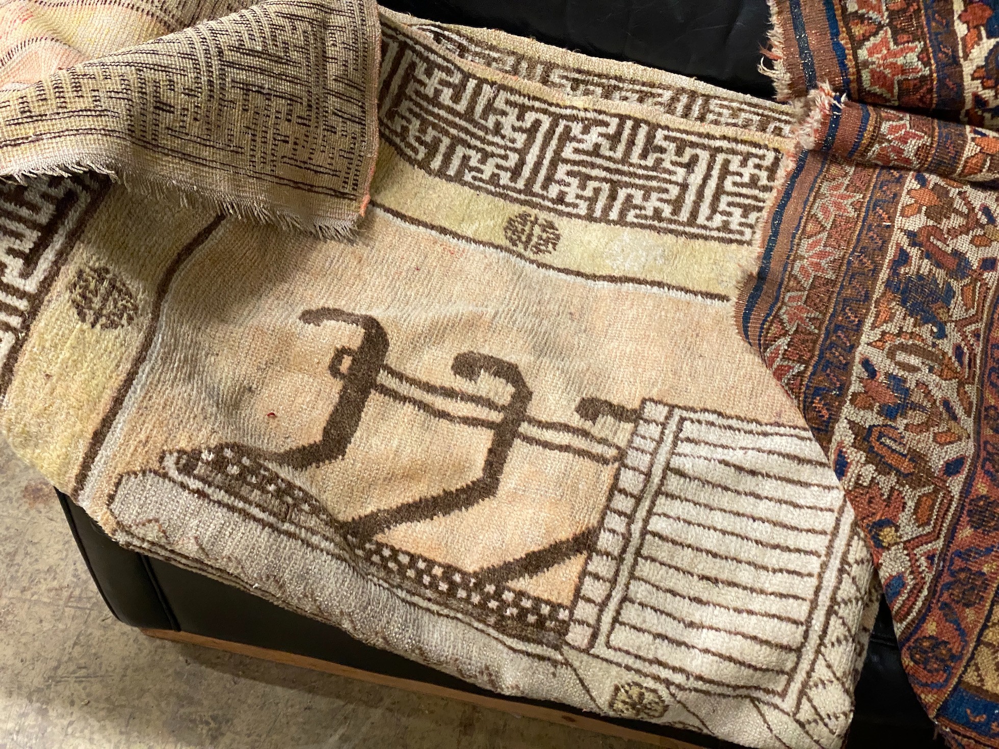 An antique Afshar rug, 190 x 34cm and a cream ground carpet with stylised Greek border